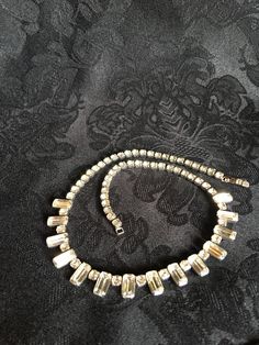 "Simple, classy & elegant Bridal Jewelry. Stunning piece for a Wedding! Authentic faceted Clear Rhinestone Necklace by Albert Weiss. Vintage 1942-1971. Signed on back of closure. Top of closure has 2 small rhinestones. Approximate measurements: 14.5\" long. Excellent vintage condition. No missing stones. International Shipping Insurance provided. A Hendersonville, NC estate find. #R2015-R9 Vintage, Home & Gifts www.MyVintageAlcove.etsy.com <-------- Shop the collection Shelf 7. Row 3. Classic Evening Crystal Necklaces, Classic Evening Crystal Necklace, Glamorous Adjustable Rhinestone Necklace For Formal Events, Vintage Formal Jewelry With Rhinestones, Antique Crystal Necklaces For Wedding, Vintage Rhinestone Jewelry For Formal Occasions, Classic Crystal Necklaces For Party, Antique Crystal Wedding Necklaces, Classic Crystal Necklace For Party