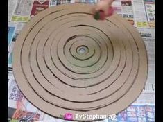 a person is making a paper circle