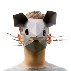 a man with a mouse mask on his face and the nose is made out of paper