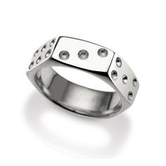 a silver ring with four holes on it