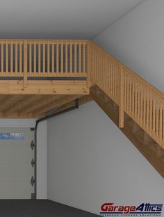 an overhead garage door with stairs leading up to the second floor and above it is a wooden staircase