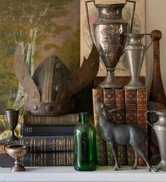 books, vases and other items on a mantle