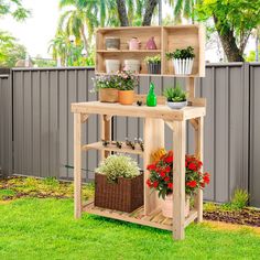 an outdoor potting station with flowers and plants