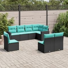 an outdoor patio furniture set with blue cushions