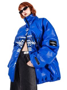 Oversized puffer jacket in a vibrant electric blue color. Features a striking black graphic across the chest depicting skeletal wings or a ribcage design, reminiscent of gothic or metal aesthetics. High collar for added warmth and style. Full-length front zipper closure in contrasting black. Model info Height: 176cm Weight: 46kg Wearing size: M Urban Puffer Jacket For Spring Streetwear, Trendy Streetwear Puffer Jacket With Padded Collar, Trendy Puffer Jacket With Padded Collar For Streetwear, Edgy Blue Outerwear For Spring, Trendy Spring Puffer Jacket For Streetwear, Trendy Halloween Streetwear Outerwear, Urban Puffer Jacket With Zipper For Streetwear, Blue Punk Outerwear For Fall, Oversized Trendy Halloween Outerwear