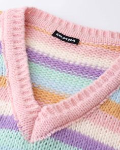 Details: Long-sleeve sweater with rainbow stripes designTop Length: CroppedSleeve Length: Long SleevesMaterials:100% Acrylic Trendy Multicolor V-neck Sweater, Multicolor V-neck Sweater Vest For Fall, Trendy Rainbow Long Sleeve Sweater, Trendy Long Sleeve Rainbow Sweater, Trendy Striped Sweater Vest For Spring, Rainbow Long Sleeve Sweater For Spring, Casual Rainbow Knitted Sweater, Spring Rainbow Long Sleeve Sweater, Long Sleeve Rainbow Sweater For Spring