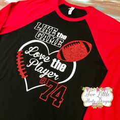 a black and red baseball shirt with the words love the player on it