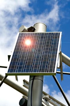 a street light with a solar panel on it