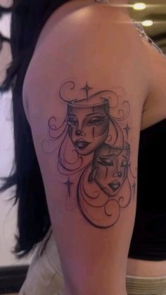 a woman with a tattoo on her shoulder