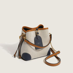 Description:Going out and about in the town is even better with this gorgeous bag! Made of PU leather and canvas. embellished with twin drawstrings to the side. featuring a magnetic buckle closure to the top along with a detachable strap. an interior zipper pocket. Find more trendy women's bucket bags or unique bags in our boutique. and elevate your daily look with our accessories. Size One Size(in) One Size(cm) Length 8.7 22.0 Height 7.9 20.0 Width 4.7 12.0 Bags Ideas, Bucket Bags, Leather And Canvas, In The Town, Pretty Bags, Unique Bags, Leather Bag Women, Leather Projects, Gorgeous Bags