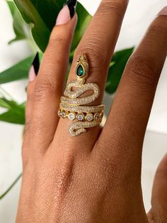 This gorgeous ring is 18kt gold plated and adjustable. Adjustable Gold Gemstone Rings, Elegant Adjustable Gold Emerald Ring, Unique Gold Plated Promise Ring Jewelry, Gold Emerald Ring With Vs Clarity In 14k Gold, Adjustable Gold Snake Ring Gift, Adjustable Gold Emerald Ring As Gift, Adjustable Gold Emerald Ring Gift, Gold Emerald Open Ring For Wedding, Adjustable Fine Jewelry Snake Ring For Anniversary