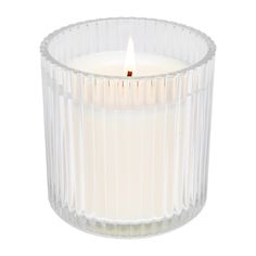 a clear glass candle with a white flame