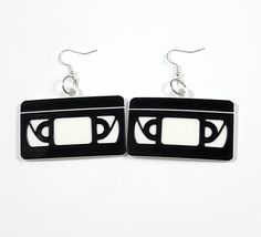 3D Printed earrings of VHS tapes. Very lightweight. Approximately 2" x 1.25" on sterling silver plated earring wires. All earrings are made with PLA. Please note that 3D printed items will have imperfections such as layer lines due to the printing process. 3d Printed Earrings, Printed Earrings, Earring Wires, Vhs Tapes, Vhs Tape, 3d Printer, Printed Items, Statement Earrings, 3d Printing