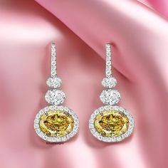 Gorgeous East West Earrings, 10x8 MM Yellow Ice Crushed Diamond Earrings, Drop Dangle Party Wear Earrings, Halo Wedding Anniversary Earrings ★ The finest grade 5A handcrafted simulated diamond made of cubic-zirconia conjures our distinctive shine.  ★ Stone Details:- ➞ Shape: Oval  ➞ Carat: 5 TCW   ➞ Size: 10x8 mm ➞ Color: Yellow  ➞ Clarity: VVS ➞ Cut: Excellent ★ Item Details:- ➞ Metal Tone: White   ➞ Hallmark/Stamp: Yes ★ Other Service:- ➞ Free Engraving (special Dates, Name & more) ➞ Gift Message (we add notes as you want) ➞ Gift Packaging Orders (Chargeable service) ➞ Rush order and Expedited Shipping Available (Chargeable Service) 🖤 Thank you very much for visit my shop 🖤 Oval Diamond Earrings For Party, White Gold Oval Earrings For Parties, Party White Gold Oval Earrings, Party Halo Design Diamond Drop Earrings, Party Halo Design Drop Diamond Earrings, Elegant Yellow Earrings With Halo Design, Fine Jewelry Party Earrings With Halo Design, Yellow Drop Earrings For Celebration, Luxury Yellow Earrings For Wedding