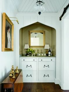 the instagram page shows an image of a bathroom with white cabinets and gold accents