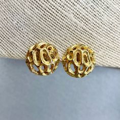 "Vintage Sarah Coventry Filigree Earrings, Gold Tone Round Clip On Earrings, Estate Costume Jewelry, Gift for Her. Era: Around 1980's. Designer signed: Sarah Coventry. Measurements: - Length: 7/8\" inch. - Width: 7/8\" inch. Details: - Embellishments: Gold Tone Plating, Round Filigree shaped earrings. - Closure: Clip-on. Here are more Vintage Jewelry items for your viewing pleasure: https://etsy.me/2SGhTFo Our shop team members do our best to research and identify items correctly and do our best Gold Clip-on Cluster Earrings For Gift, Gold Clip-on Cluster Earrings As Gift, Cadmium-free Brass Earrings For Anniversary, Hypoallergenic Gold Cluster Earrings As Gift, Vintage Gold Cluster Earrings Gift, Brass Clip-on Earrings For Gift, Brass Clip-on Earrings As Gift, Unique Gold Round Clip-on Earrings, Team Members