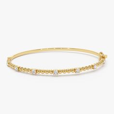 Enhance your wrist's beauty with our Diamond Bracelet Bangle, a striking piece featuring 14K Gold Beaded detail and a minimalist design. This Gold Layering Bracelet adds a touch of elegance to your ensemble, perfect for stacking or wearing alone. Explore the allure of our Minimalist Beaded Diamond Bracelet, an exquisite and thoughtful gift idea that radiates timeless charm. ▶ Item Details * Made to Order.  * Gold Kt: 14K Solid Gold (also available in 18K upon request) * Custom Gold Color: Rose Gold, Yellow Gold, White Gold * Round Diamonds: 7 Pcs 2.3 MM * Total Diamond Weight: 0.35CTW * Ready to Ship in 3-10 Business Days ▶ See more of our Gold Bangle - http://etsy.me/2l9VKBr ▶ See our storefront here - http://etsy.me/2lUcVnH  ▶ All store sections here * Diamond Rings - http://etsy.me/2lwK Yellow Gold Bangle Beaded Bracelets In Fine Jewelry, Yellow Gold Bangle Beaded Bracelets, Fine Jewelry, Yellow Gold Bangle Beaded Bracelets, Classic Beaded Bangle Bracelets For Formal Occasions, Classic Formal Beaded Bangle Bracelets, Luxury Hand-strung Round Bracelet, Yellow Gold Stackable Rondelle Bracelets, Yellow Gold Rondelle Bracelets Fine Jewelry, Stackable Rondelle Yellow Gold Bracelets