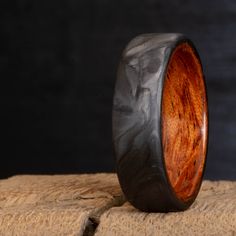 forged carbon fiber ring with bubinga wood Carbon Fiber Rings For Men, Mens Wedding Bands Carbon Fiber, Carbon Fiber Mens Ring, Titanium And Wood Ring, Wood Rings Women, Koa Wood Ring, Carbon Fiber Rings, Mens Wedding Bands Unique, Wood Insert