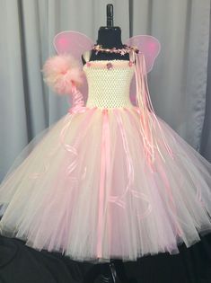 Fuzzy Duckling Design dresses ~ handcrafted for the little princess in your life. Our beautiful dresses feature a stretchy, crocheted bodice that is fully lined for both comfort and modesty. The full skirts sparkle and shine with two layers of high quality tulle in matte, shimmer, and glitter finishes. Satin ribbons and jewels are added to make each dress something special. She'll feel like a fairy princess when wearing her matching accessories. This dress includes a matching sparkly ribbon crow Pink Fairy Dress, Fairy Costume For Girl, Fairy Princess Birthday, Fairy Princess Costume, Princess Tutu Dresses, Birthday Fairy, Wings Fairy, Costume Princess, Princess Tutu Dress