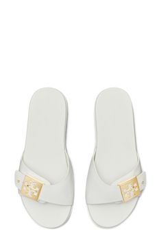 A logo-accented buckle adds signature appeal to a slide sandal set on a contoured footbed for a comfortable fit. Adjustable strap with buckle closure Synthetic upper/leather lining/rubber sole Imported White Set, Sandal Women, Slide Sandals, Tory Burch, Rubber Sole, Womens Sandals, Adjustable Straps, Comfort Fit, Nordstrom