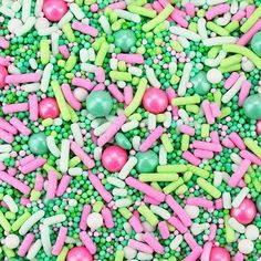 colorful sprinkles and candies are scattered on top of each other in this image