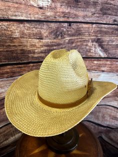 Vintage Bailey U-Rollit Straw Cowboy Hat - Iconic Western Style ### Full Description: Step into classic Western style with this vintage Bailey U-Rollit straw cowboy hat. This hat embodies the rugged charm of the American West, featuring a durable, tightly woven straw construction that offers both breathability and protection from the sun. The hat is in excellent condition, with minimal signs of wear, maintaining its sturdy structure and iconic shape. Key features include: - **Brand Bailey U-Rollit - **Material High-quality straw - **Color Natural straw tone - **Size One size fits most - **Details The hat sports a tan hatband, adding a touch of understated elegance, perfect for both everyday wear and special occasions. - **Condition Excellent vintage condition, with the original Bailey logo Fitted Brown Straw Hat For Western-themed Events, Vintage Straw Hat For Summer Western-themed Events, Brown Fitted Western Straw Hat, Vintage Adjustable Straw Hat For Western-themed Events, Beige Western-style Woven Straw Hat, Straw Cowboy Hat, Hat Band, Western Fashion, Cowboy Hats