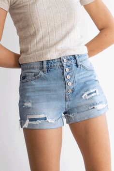 Our new favorite ultra high rise short gives an edgy vibe that's perfect for everyday wear. They pair best with casual tees or crop tops for a comfortably chic look. Featuring whiskering, fading, distressed details, folded hem, 5-pocket design, and a five button front closure. Rigid 100% Cotton Rise 11.25" Inseam 3" (Medium) Relaxed Fit High-waisted Cotton Jean Shorts, Relaxed Fit High-waisted Shorts With Frayed Hem, Knee-length Distressed Cotton Jean Shorts, Mid-rise Cotton Jean Shorts With Belt Loops, High-waisted Shorts With Frayed Hem In Medium Wash, Cuffed Denim Shorts, High Rise Shorts, Casual Tee, Denim Shorts