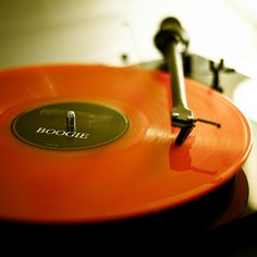 an orange record player with the word boogie on it