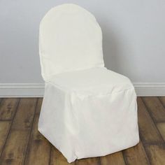 a white chair sitting on top of a hard wood floor