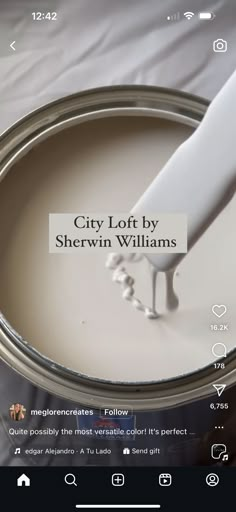 a white paint can being painted with the words city loft by sherylin williams