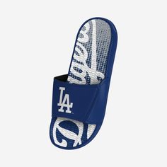 Be sure to thank your feet for all that walking they help you do by keeping them comfy in these Los Angeles Dodgers Gradient Wordmark Gel Slides! Features Gradient, team-colored design with bold wordmark logo display on footbed so you can fan on with every step Team logo display on straps, in case there were any doubts where your allegiances lie Gel overlay on footbed to keep your feet feeling as good as they look Two-piece reinforced padded adjustable strap to keep you secure Textured outsole s Sporty Slip-on Slides For Sports, Comfortable Breathable Sport Sandals For Sports, Comfortable Breathable Sport Sandals, Non-slip Slip-on Sport Sandals, Sporty Synthetic Slides For Leisure, Breathable Sports Slides, Breathable Slides For Sports, Sporty Sneakers With Logo Print For Sports Events, Breathable Sporty Slide Sandals