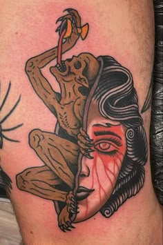 a man's leg with a tattoo on it and an image of a woman holding a