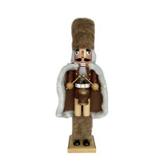 a nutcracker is standing on a wooden stand