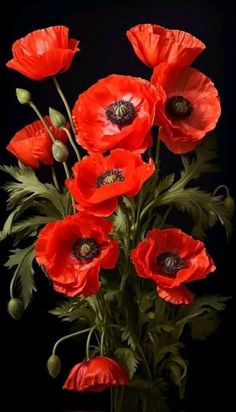 a vase filled with red flowers on top of a table