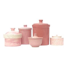 pink kitchen canisters with lids on white background