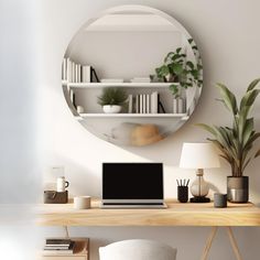 a laptop computer sitting on top of a wooden desk in front of a round mirror