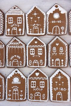 gingerbreads decorated with white icing are arranged in rows