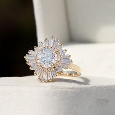 a diamond ring sitting on top of a white box