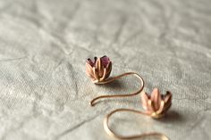 Rough Garnet lotus earrings. The deep red garnets pair perfectly with the rose gold of the earrings. Stunning! The lotus is set in to my coveted french ear wire dangles. Super light on the ear and a perfect drop length. Garnet is January's birthstone. The pair pictured has now sold, yours will be very similar. If you would like a different gemstone or crystal, let's start a custom order. My Lotus Series pieces are protected under copyright by the US Government. Do not copy. I love these as spark Rose Gold Ruby Earrings For Gifts, Elegant Electroformed Jewelry For Anniversary, Unique Opal Ring, Unique Opal, Lotus Earrings, Gemstone Drop Earrings, Peach Moonstone, Moonstone Earrings, Red Garnet