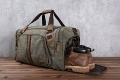 Travel Duffel Bag, Waterproof Canvas Leather Weekend bag, Carry on Weekender Overnight Bag with Shoes Compartment for Men Women Personalized Features and details : 【Premium Material】The sturdy thick canvas, genuine top cowhide leather, and strong metal hardware make this a great travel bag. The high-density canvas won't rip or tear when you put a lot of things in the duffel tote.And the quality solid zinc-alloy hardware won't gather rust easily.Features a double-sided smooth YKK zipper and reinf Monogrammed Duffle Bag, Travel Duffel Bag, Leather Duffel Bag, Leather Weekender Bag, Leather Weekender, Leather Duffel, Leather Duffle Bag, Mens Travel Bag, Leather Duffle