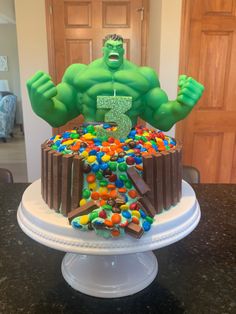 the hulk cake is decorated with candy and sprinkles