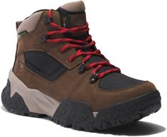 a pair of brown hiking boots with red laces on the outstretches