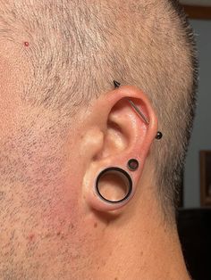 a man with ear piercings on his ears