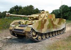 a camouflaged tank driving down a dirt road next to some grass and trees in the background