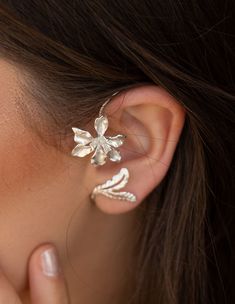 A beautiful handmade 925 sterling silver Earring These Orchid Floral Ear Cuff, earrings is made of excellent quality materials and is fully hypoallergenic & nickel free. It is also tarnish resistant. Ear cuffs are the coolest accessory at the moment! Cuff earrings embrace and flatter your ears, they make them look even more dainty and give you that feminine vibe you want. A simple pair of earrings that can be worn every day. Price is for Single Please see all photos and select the color you Dainty Silver Ear Cuff For Wedding, Dainty Sterling Silver Ear Climbers For Wedding, Handmade Elegant Ear Climbers, Sterling Silver Ear Cuff With Ear Wire For Weddings, Elegant Silver Ear Climbers, Unique Silver Wrap Earrings, Silver Sterling Silver Wrap Earrings For Wedding, Sterling Silver Wedding Ear Cuff, Silver Ear Climbers For Wedding