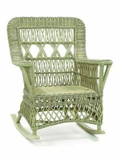 a green wicker rocking chair on a white background