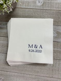 personalized napkins with the names and date printed on them