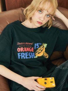 Editor's NotesCPGN's casual T-shirt features orange motif colorful artwork that expresses graphics and lettering in detail with digital printing technique. It's cut for a relaxed silhouette from high-density 20s single cotton jersey.- Ribbed crew neck- Graphic print on the front- Drop shoulder- Short sleeves- Point logo label at the side- Oversized fit- Unisex wear- Minimize shrinkage and distortionMeasurements (in.) M / L - Total Length: 28.3 in. / 29.1 in.- Shoulder: 20.9 in. / 21.7 in. - Ches Retro Shorts, Colorful Artwork, Logo Label, W Concept, Casual T Shirt, Printing Techniques, Casual T Shirts, Digital Printing, Graphic Prints