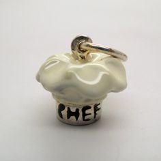 "This three-dimensional, sterling silver Chef Hat charm is beautifully hand-enameled in white. The silver band on the hat is inscribed with the word Chef. Made by Brown County Silver. Vintage but in brand new, never worn condition. Diameter 1/2\" diameter Weight 3.5 grams See more @ https://www.etsy.com/shop/brocosi" Novelty White Sterling Silver Jewelry, White Sterling Silver Novelty Jewelry, Gifts For Chefs, Gift For Chef, Brown County, Chef Hat, Baking Gifts, Chef Gifts, Food Jewelry