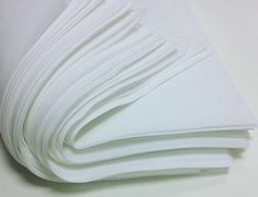 several sheets of white paper stacked on top of each other